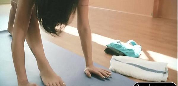  Busty trainer teaching yoga exercises